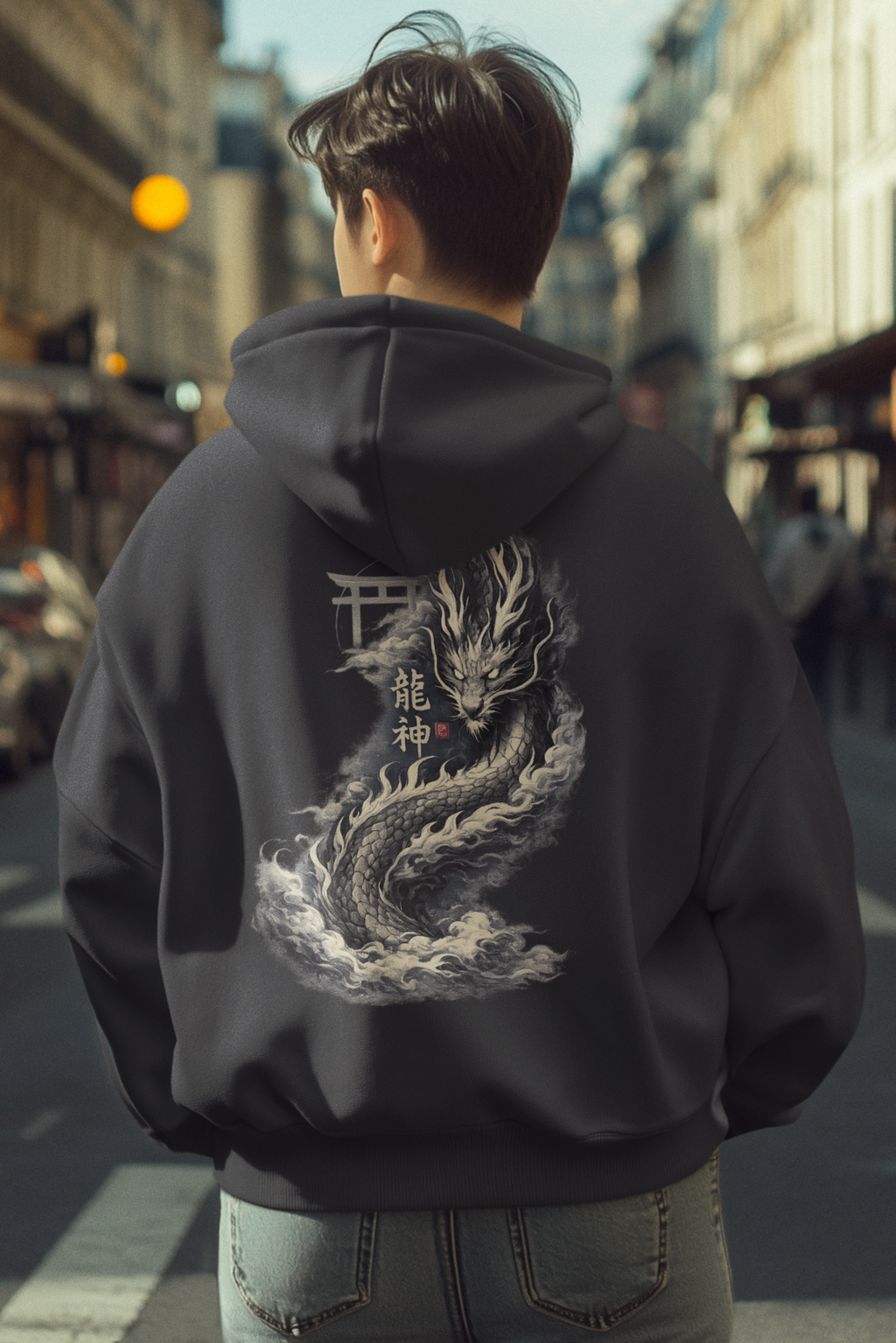 Person wearing a hoodie with a dragon design on a city street